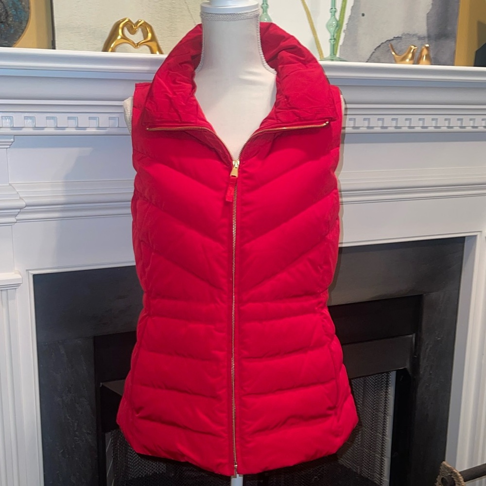 Talbots red zipper puffer vest with two pockets and two back button snaps.